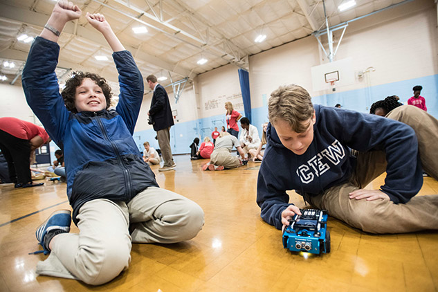 Students in gym interact with TI-Innovator™ Rover