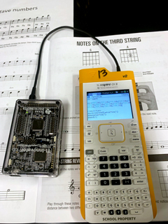 Figure 1: Students learn how to code music from sheet music. This music is played on the TI-Innovator™ Hub using Python programming and the code sound.note(“note”, time).