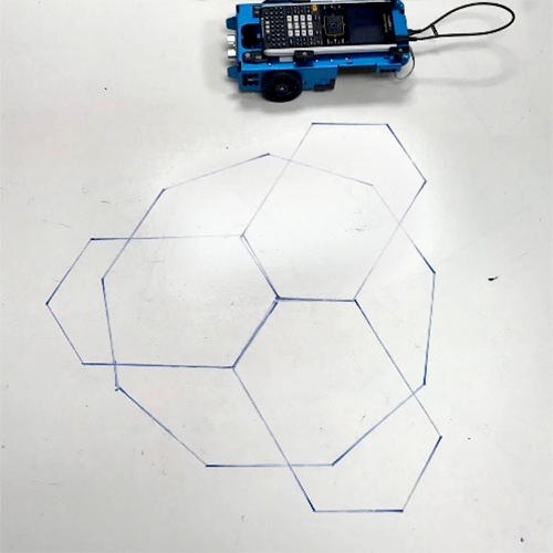 The TI-Innovator™ Rover drawing a series of geometric shapes using coding.